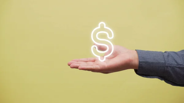Χέρι Κρατώντας Ένα Σύμβολο Δολάριο Στο Παρασκήνιο — Φωτογραφία Αρχείου