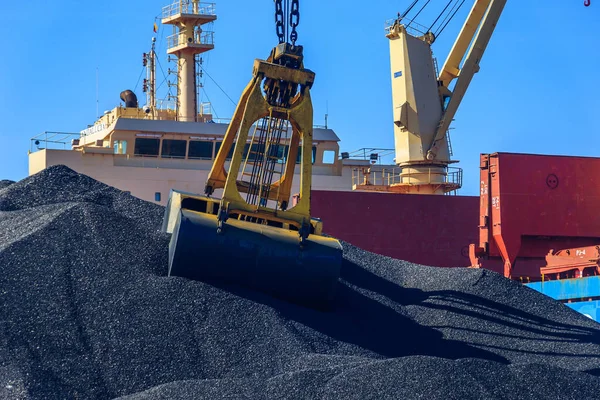 excavator on the sand of the sea