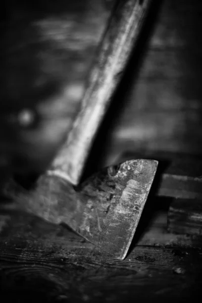 Stock image old wooden table with a hammer