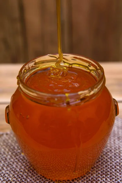 Méz Egy Üveg Fából Készült Háttér — Stock Fotó