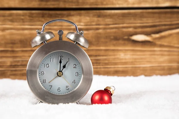 Christmas Time Concept Alarm Clock Snow Wooden Background Royalty Free Stock Photos