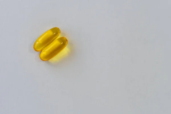 Pílulas Amarelas Brancas Fundo Claro — Fotografia de Stock