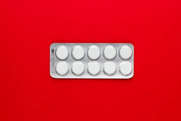 Pills Blister Pack Red Background Top View — Stock Photo, Image