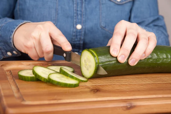Woman Cutting Cucumber Wooden Board Royalty Free Stock Images