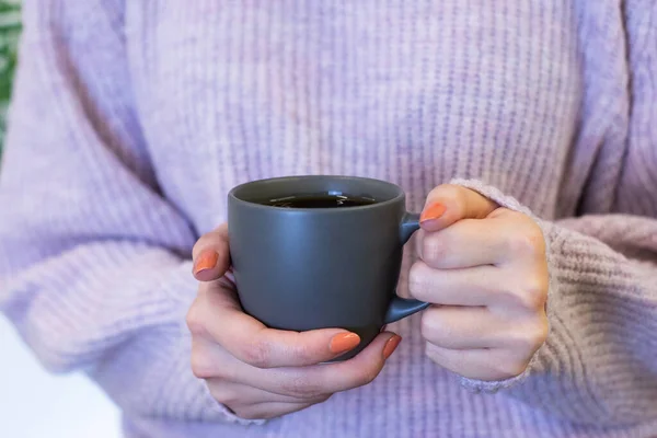 filter coffee in white mug, woman holding in hand