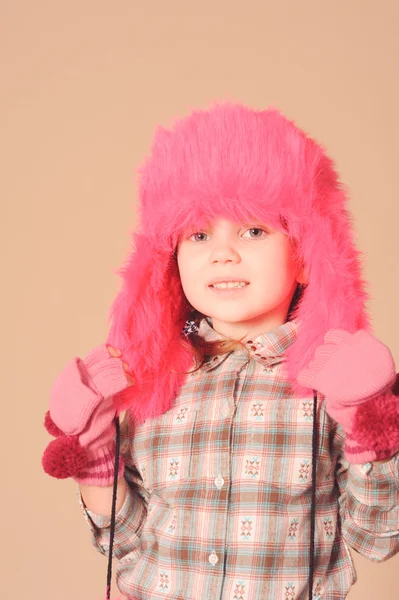 Cute baby girl wearing fur hat in studio — Stock Photo, Image