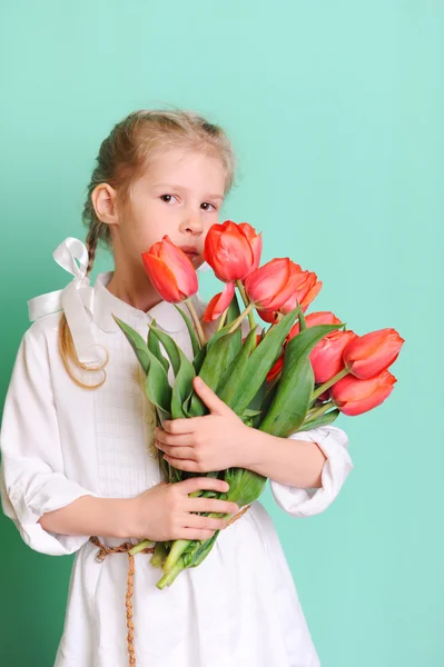 Little girl with tulips — Stock Photo, Image