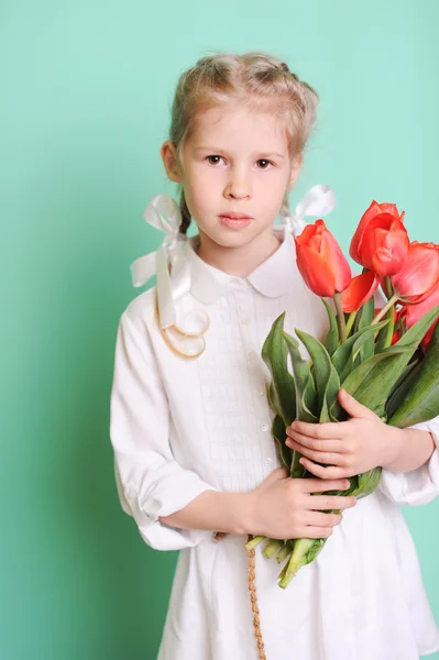 Little girl with tulips — Stock Photo, Image