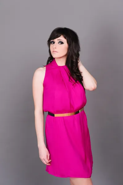 Woman wearing pink dress — Stock Photo, Image