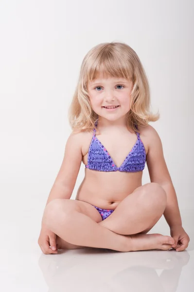 Little girl in swimsuit — Stock Photo, Image