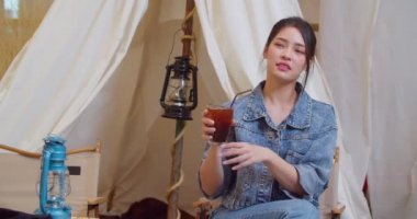 Beautiful Asian girls are happy to drink soft drinks. Slow Motion 4K DCI (The submitted footage is a grouping shooting arrangement)