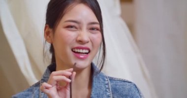 Beautiful Asian girl with a smile and happiness. CU Shot, Slow Motion, 4K (The submitted footage is a grouping shooting arrangement)