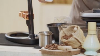 Professional baristas making coffee like a Siphon Coffee Maker. 4k Slow Motion video  (The submitted footage is a grouping shooting arrangement)