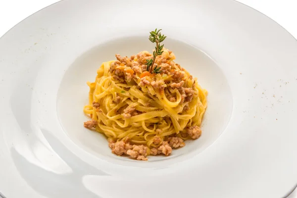 Piedmontese tajarin, tagliolini are a fresh egg pasta of the Langhe culinary tradition, seasoned with sausage ragu in a white dish