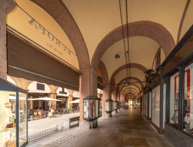 Saluzzo, Cuneo, Italy - October 19, 2021: The arcades of via Silvio Pellico, central pedestrian street