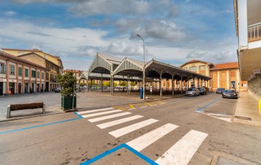 Saluzzo, Cuneo, Italy - October 19, 2021: the Covered Market, called Ala di Ferro (Iron Wing) in piazza Camillo Benso Conte di Cavour 