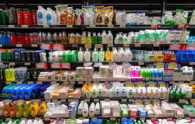 Fossano, Italy - November 25, 2021: hand soap, neutral detergents, intimate cleanser, bubble bath displayed on italian supermarket shelf in the body care department