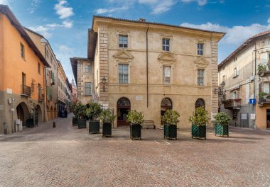 Saluzzo, Cuneo, Italy - October 19, 2021: Piazzetta Santa Maria with the Palazzo dei Vescovi, Palace of the Bishops, seat of the Diocesan Museum of Sacred Art and Diocesan Library.