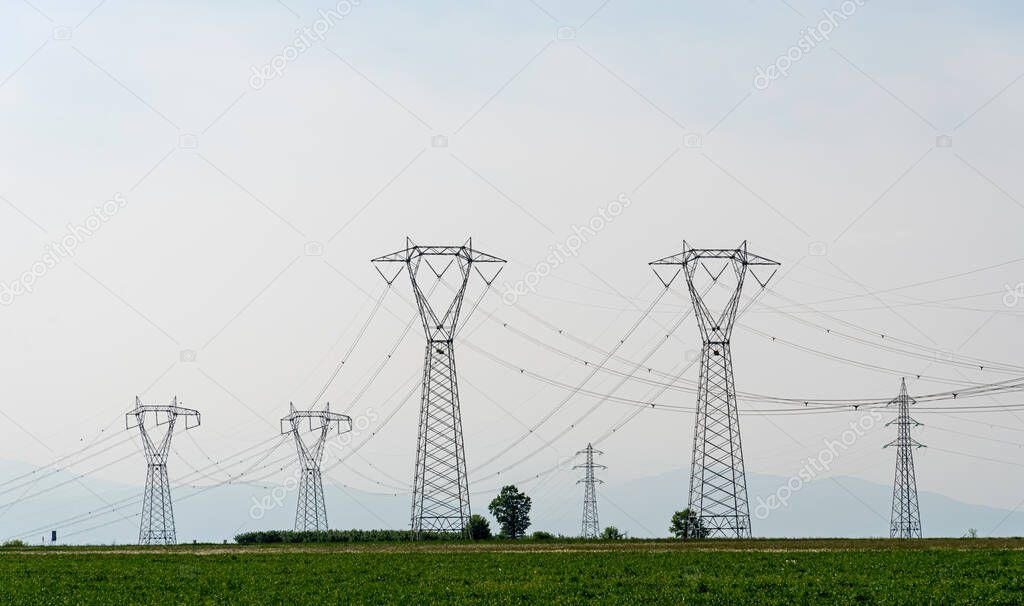 High voltage power lines, high voltage electrical transmission towers, copy space
