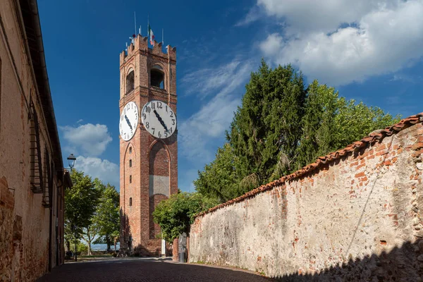 Mondovi, Cuneo, Piedmont, Italy - August 08, 2022: the Civic Tower, called  - dei Bressani - or Clock Tower, in Belvedere Gardens on blue cloudy sky