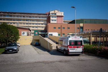 Savigliano, Cuneo, Italy - August 09, 2022: ambulance of the Red Cross of Savigliano that climbs the ramp towards the emergency room of the SS Annunziata Hospital ASL CN1. First aid concept