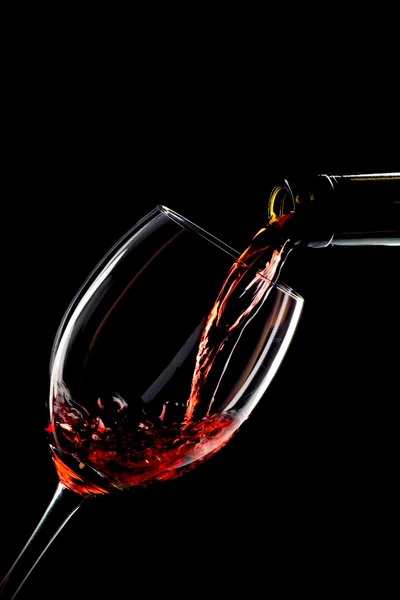 Red wine poured into a glass — Stock Photo, Image