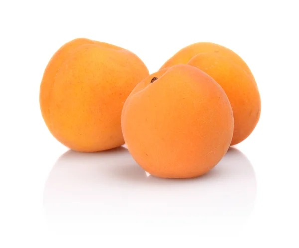 Three whole apricots isolated on white — Stock Photo, Image