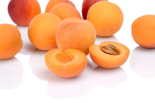 Several sliced apricots isolated on white — Stock Photo, Image