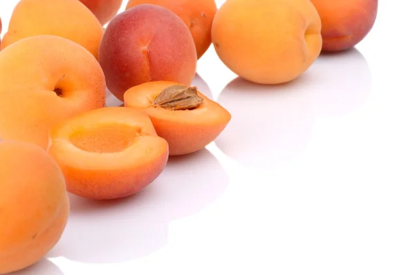 Several sliced apricots isolated on white — Stock Photo, Image