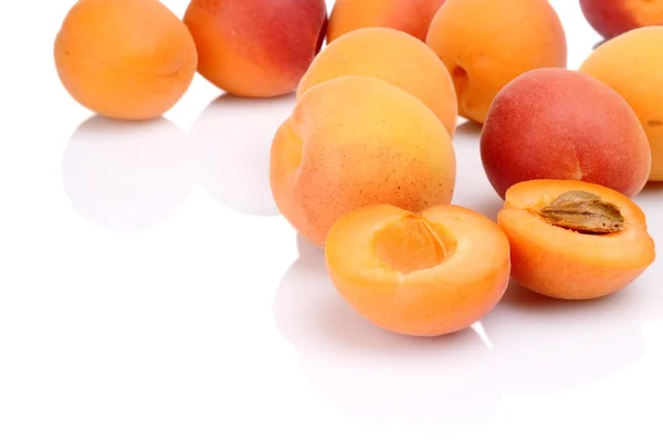 Several sliced apricots isolated on white — Stock Photo, Image