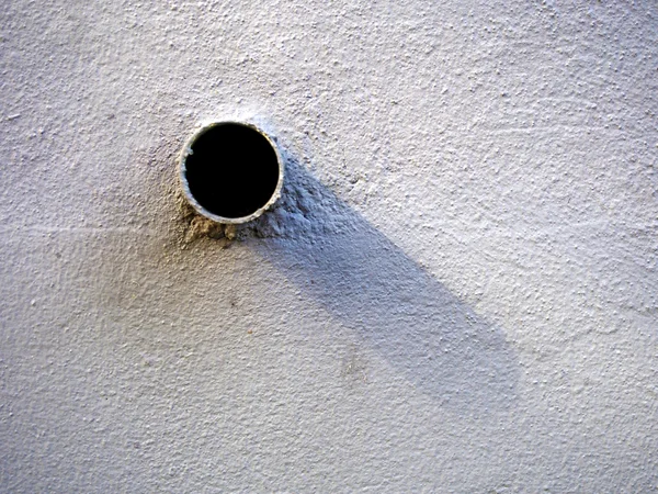 Pipe and shadow on the wall texture — Stock Photo, Image