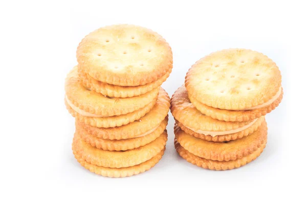 Arašídové máslo smetanou a sušenek, bílé pozadí — Stock fotografie