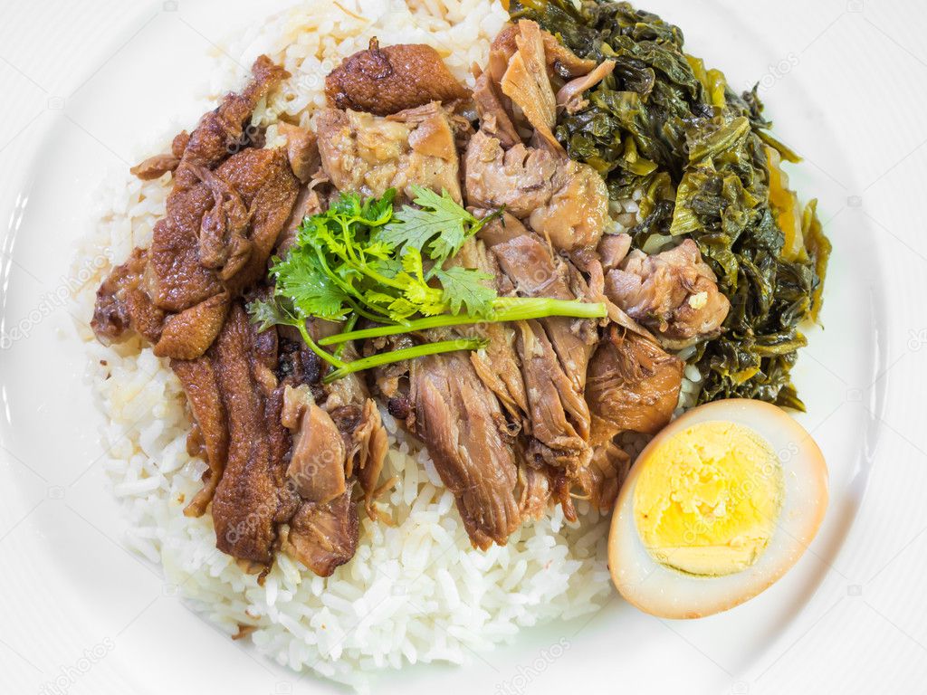 Stewed pork leg on rice with boiled egg and preserve