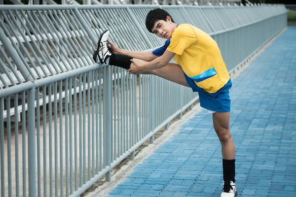 Asian man warm up before exercise — Stock Photo, Image
