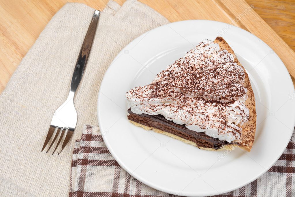 Chocolate Tart with cream and cocoa powder on the top