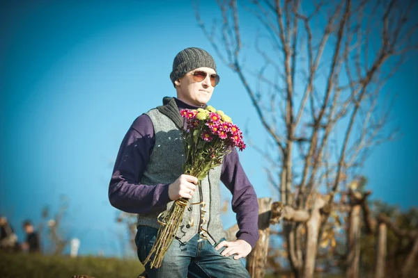 Man with flowers — Stock Photo, Image