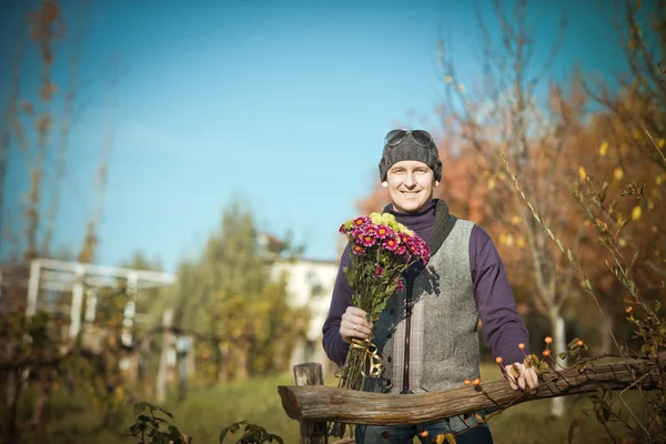 Man with flowers — Stock Photo, Image