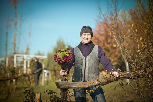 Man with flowers — Stock Photo, Image