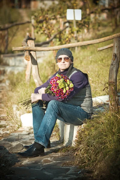 Man with flowers — Stock Photo, Image