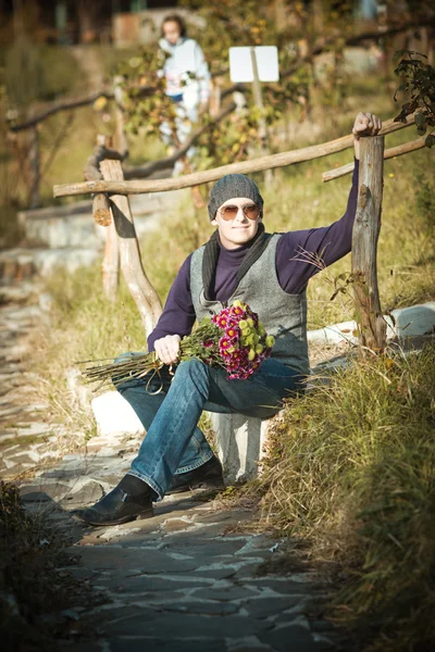 Man with flowers — Stock Photo, Image