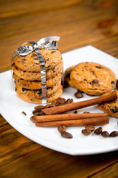 Cookies tied with ribbon on a white plate — Stock Photo, Image