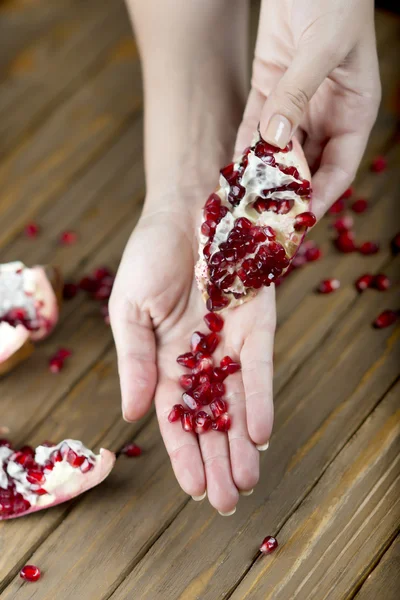 Pomegranate fruit on the table, sliced