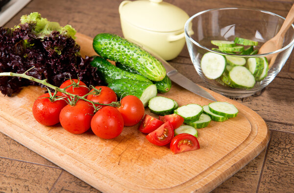 Preparation of salad from fresh vegetables.