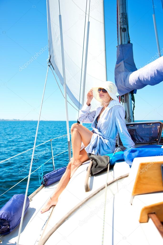 beautiful girl resting on the yacht