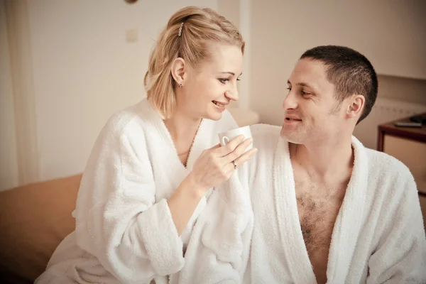 Man and woman lie on bed — Stock Photo, Image