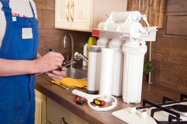 Plumber change the water filter clipart