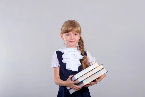 Linda hermosa colegiala con libros — Foto de Stock