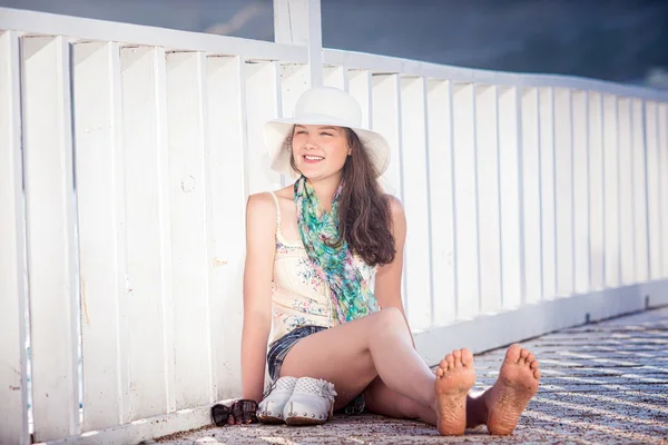 Portrait of young happy beautiful girl outdoors in sunny summer day