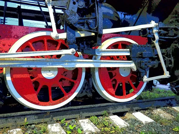 Retro vintage wielen van een locomotief of trein close-up. Rode grote zware metalen wielen met zuigergeleidingsmechanismen. Locomotief van de 19e - 20e eeuw met een stoommachine. Heldere levendige foto — Stockfoto