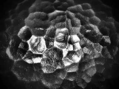 Oluklu cam, arka ışık kaynağı. Şeffaf ve düz olmayan bir yüzeyde yansıma ve parıltı oyunu. Karanlık ve aydınlık soyut asimetrik aydınlatma düzlemleri. Soyut arkaplan. Siyah vignette